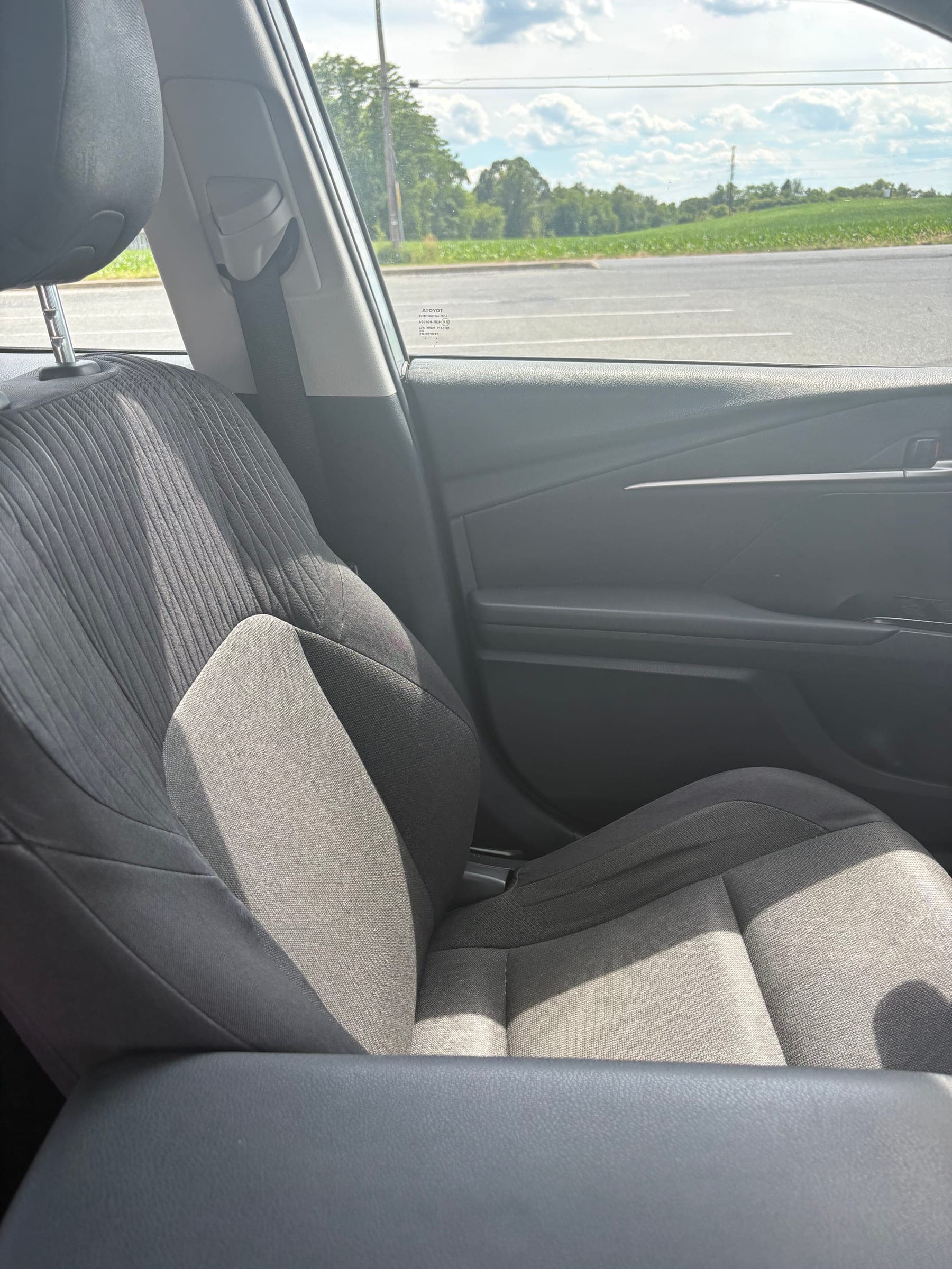 Detailed front seat with crisp, spotless upholstery and clean side bolster